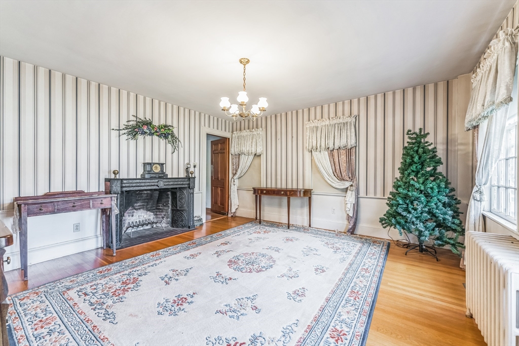 114 Summer Street Maynard, MA 01754 - Photo 27 of 32 a living room with furniture and a fireplace