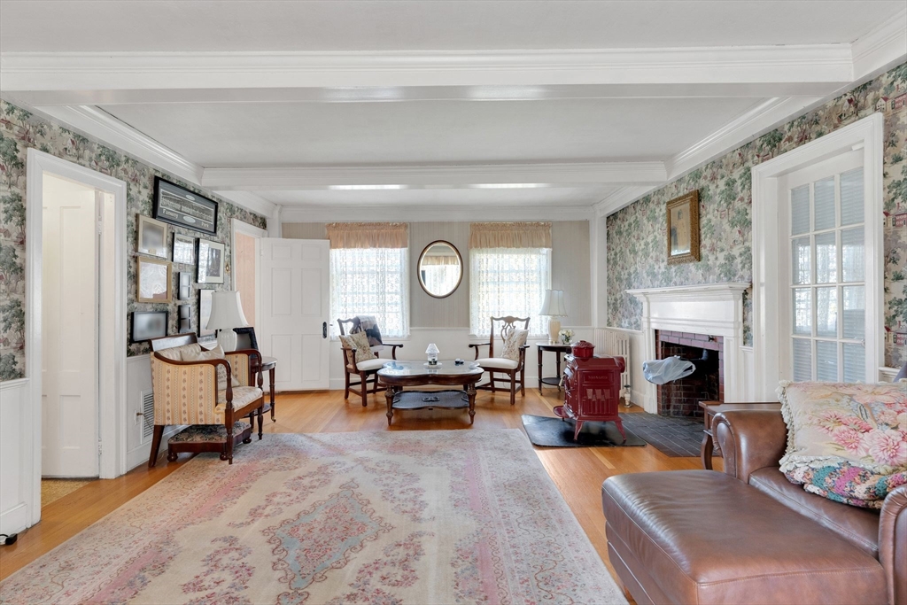 114 Summer Street Maynard, MA 01754 - Photo 28 of 32 a living room with furniture fireplace and a large window