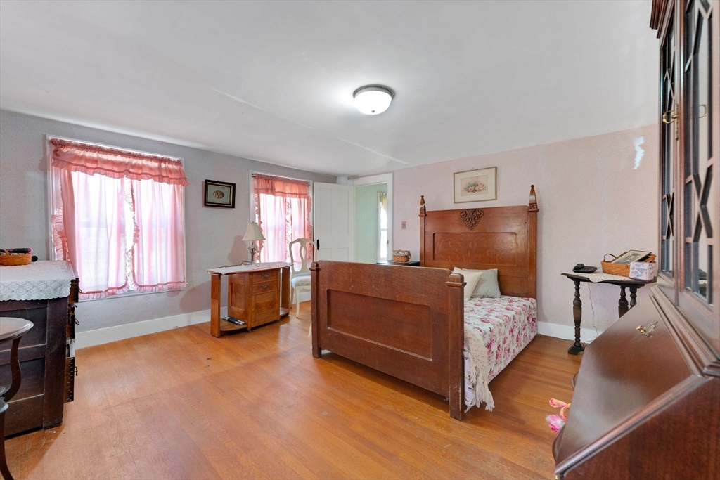 114 Summer Street Maynard, MA 01754 - Photo 3 of 32 a bedroom with a bed and a couch