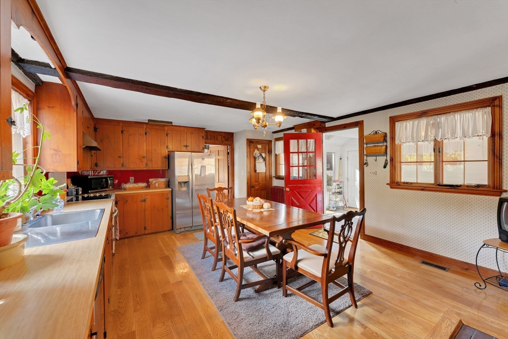 114 Summer Street Maynard, MA 01754 - Photo 7 of 32 a dining room with furniture and wooden floor