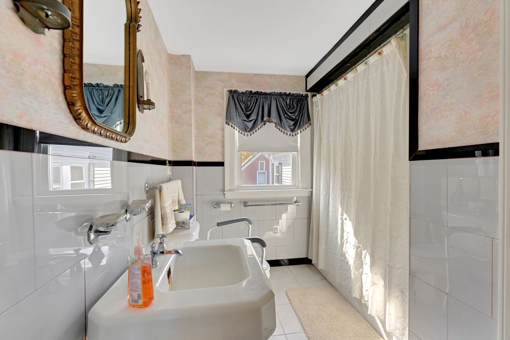 114 Summer Street Maynard, MA 01754 - Photo 9 of 32 a bathroom with a sink and a mirror