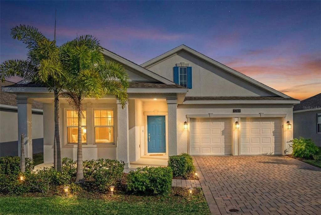 1751 Good Neighbor Loop Kissimmee, FL 34744 - Photo 1 of 1 a front view of a house with garden