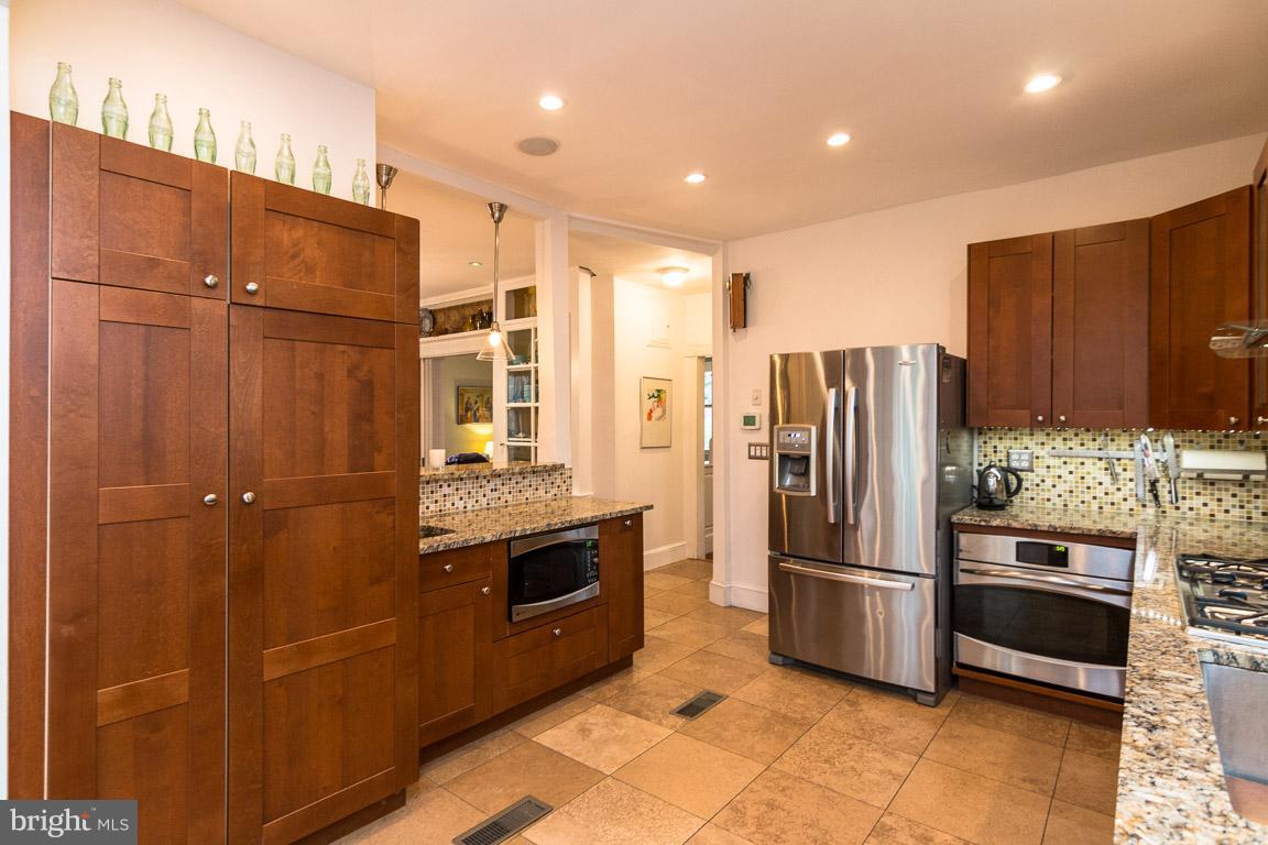 209 Oakdale Road Baltimore, MD 21210 - Photo 11 of 29 Kitchen opens to dining room with breakfast bar!