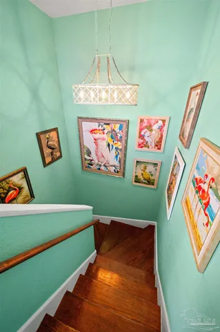 a view of a room with shelves and wooden floor