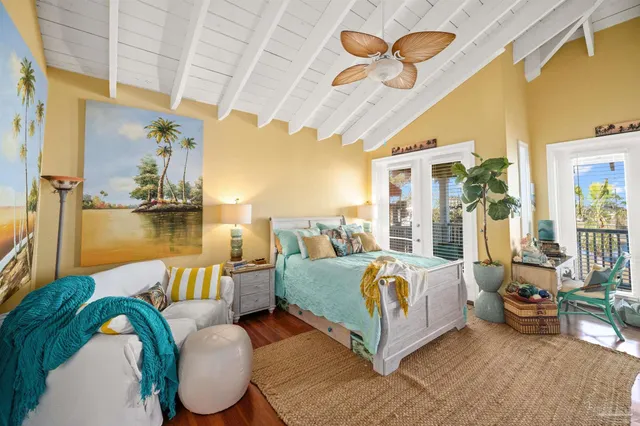 a bed room with a bed and a chandelier