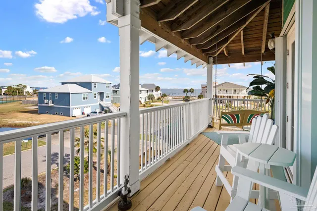 a view of a balcony with furniture