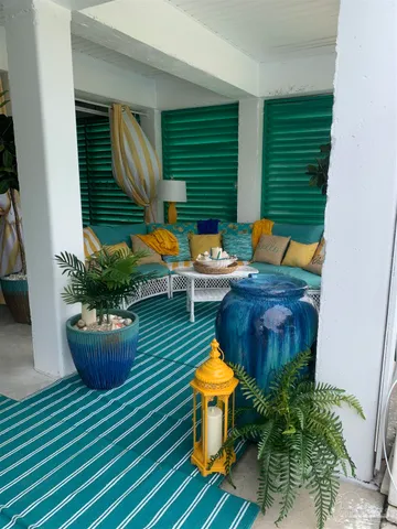 a view of a two chairs in back of the house