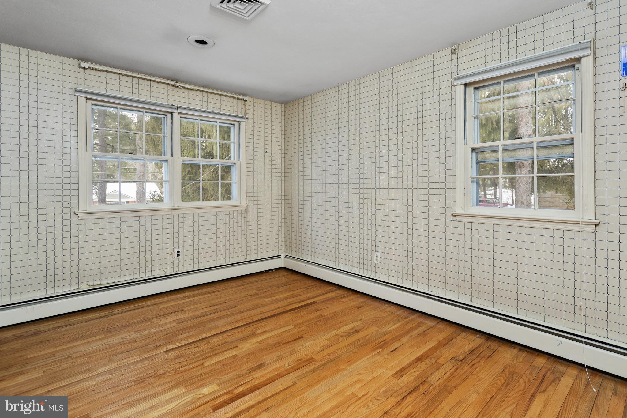 11 Mountain Vw Road Ewing, NJ 08628 - Photo 28 of 36 an empty room with wooden floor and windows