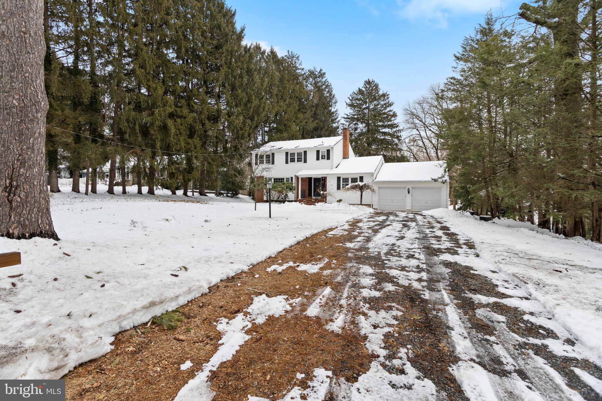11 Mountain Vw Road Ewing, NJ 08628 - Photo 5 of 36 a view of a white house with a yard covered in snow