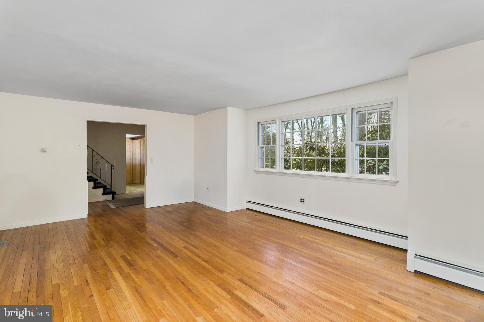 11 Mountain Vw Road Ewing, NJ 08628 - Photo 8 of 36 an empty room with wooden floor and windows