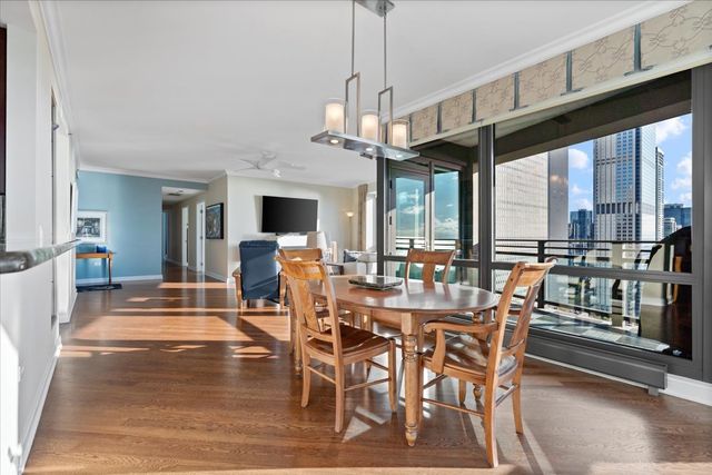 a view of a dining room with furniture window and outside view