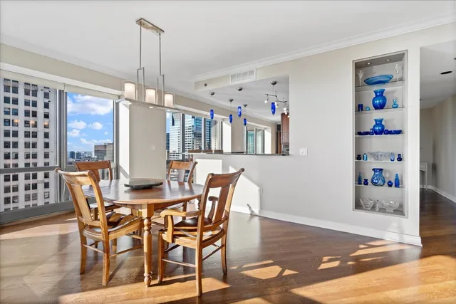 a kitchen with stainless steel appliances granite countertop sink stove refrigerator and cabinets