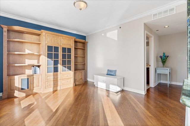 a view of an empty room with a large window