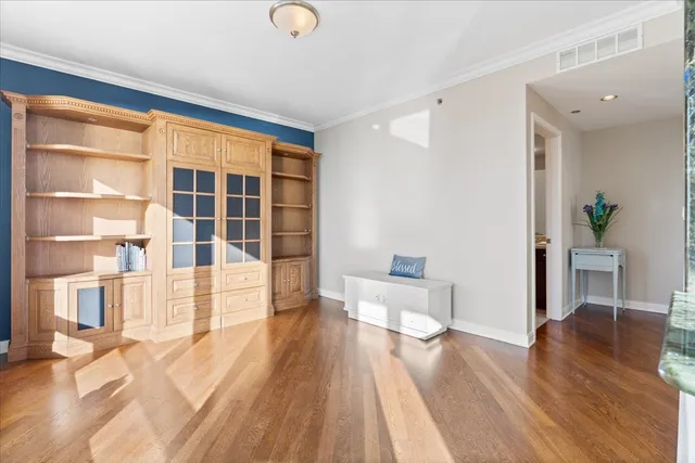 a view of an empty room with a large window