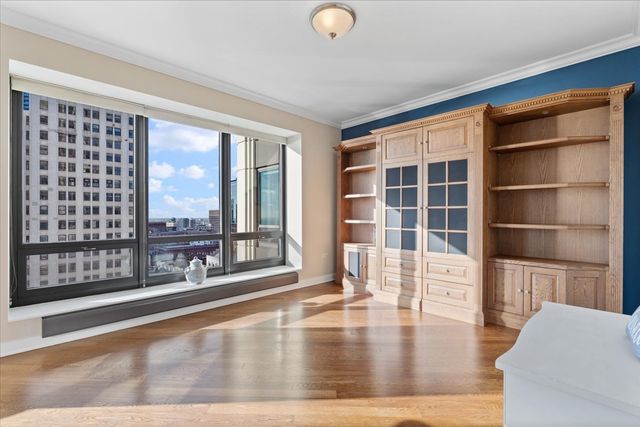 a bathroom with a double vanity sink mirror and shower