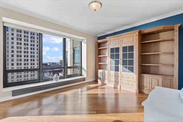a bathroom with a double vanity sink mirror and shower