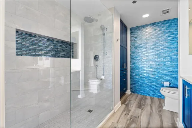 a view of walk in closet with clothes