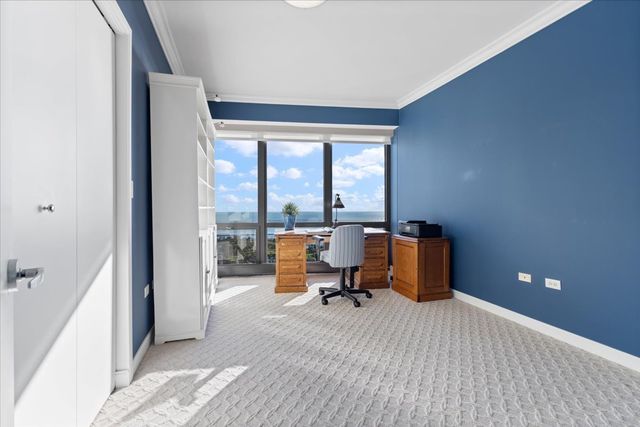 a kitchen with a sink and a refrigerator