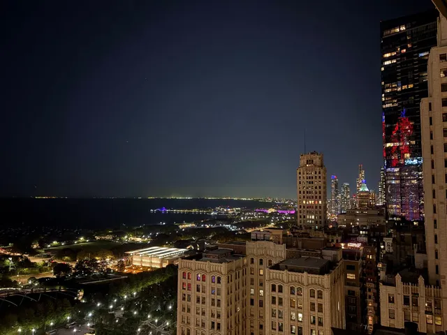 a living room with lots of furniture and a large window