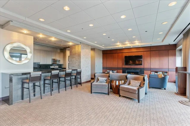 a living room with fireplace furniture and a flat screen tv