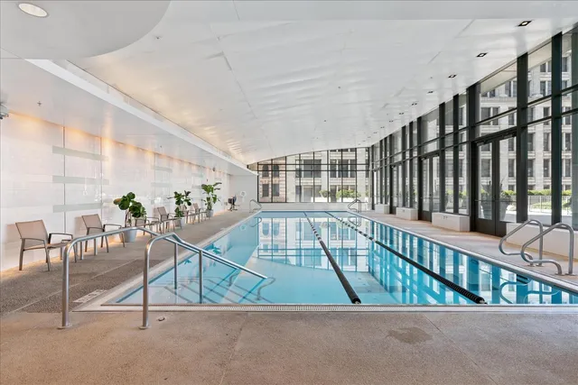 a dining room with table & chairs