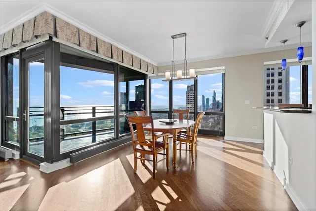 a view of a dining room with furniture window and wooden floor
