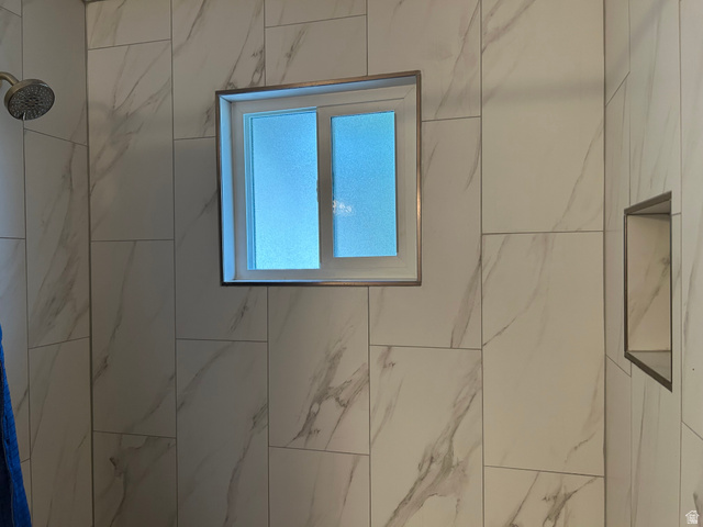 7659 State Street Midvale, UT 84047 - Photo 14 of 33 Bathroom view of a marble finish shower