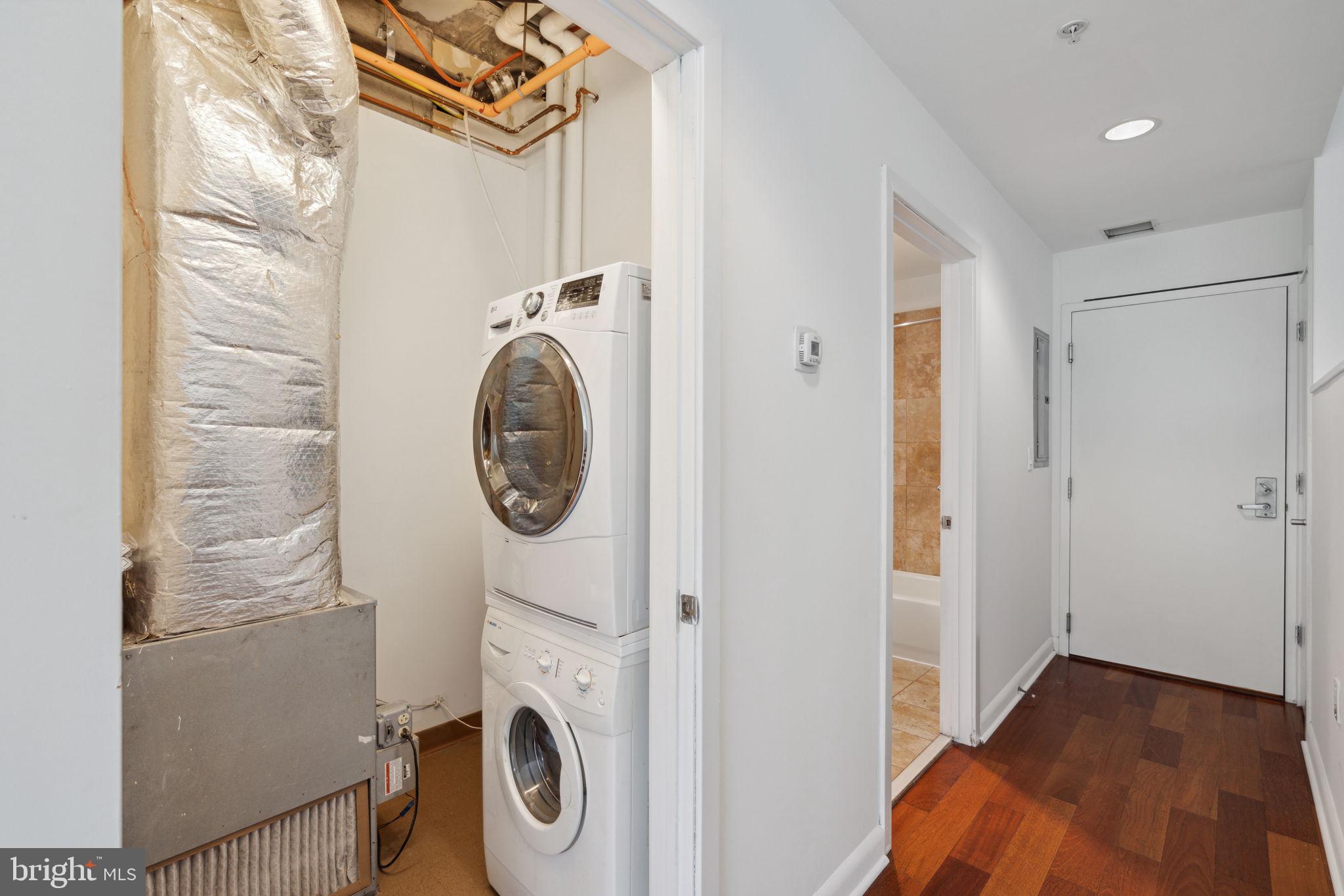 22 South Front Street, Unit 304 Philadelphia, PA 19106 - Photo 11 of 20 a view of storage and utility room with washer and dryer