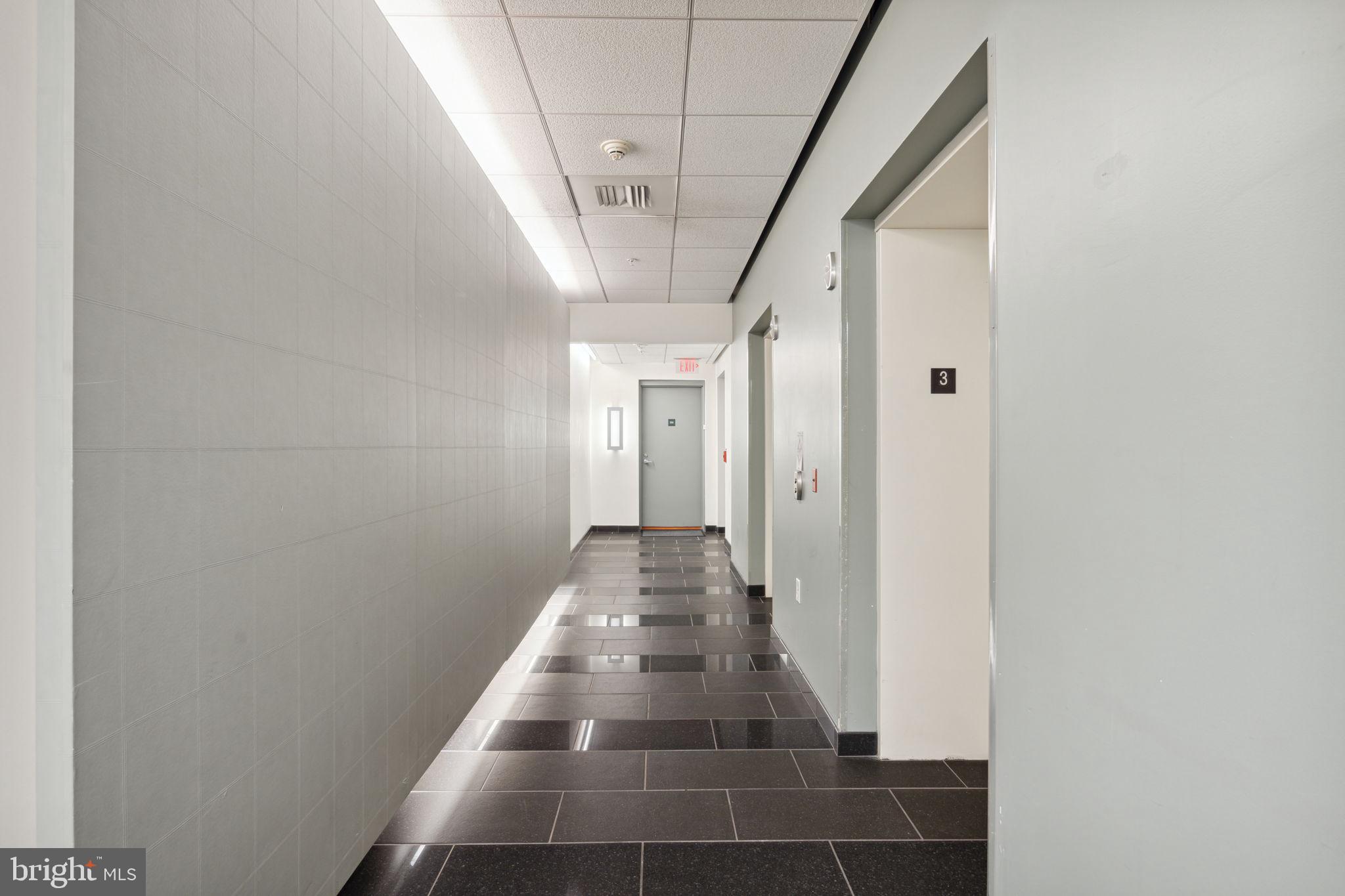 22 South Front Street, Unit 304 Philadelphia, PA 19106 - Photo 15 of 20 a view of a hallway with wooden floor and staircase