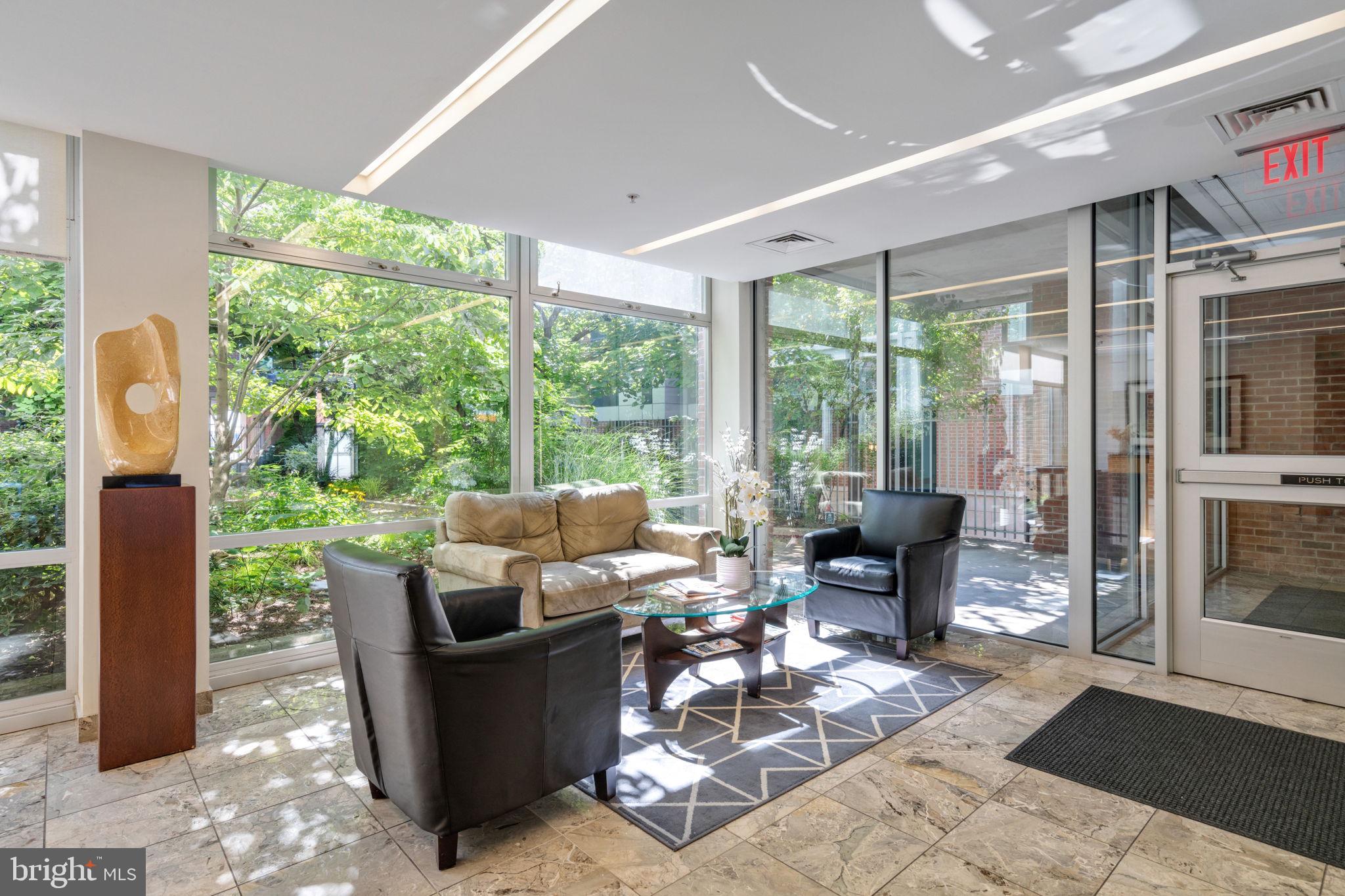 22 South Front Street, Unit 304 Philadelphia, PA 19106 - Photo 16 of 20 a living room with furniture and floor to ceiling windows