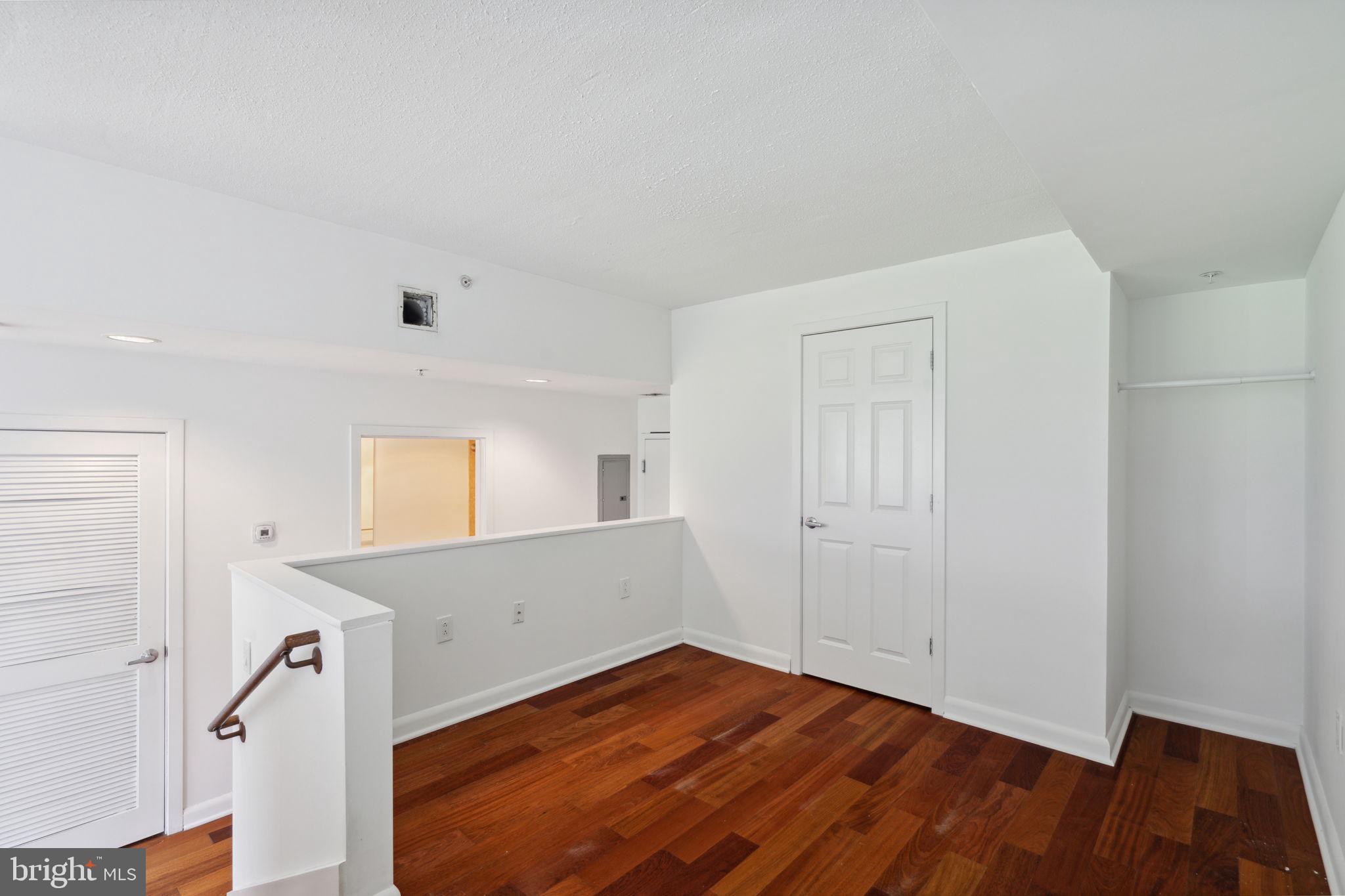 22 South Front Street, Unit 304 Philadelphia, PA 19106 - Photo 9 of 20 a view of empty room with wooden floor and fan