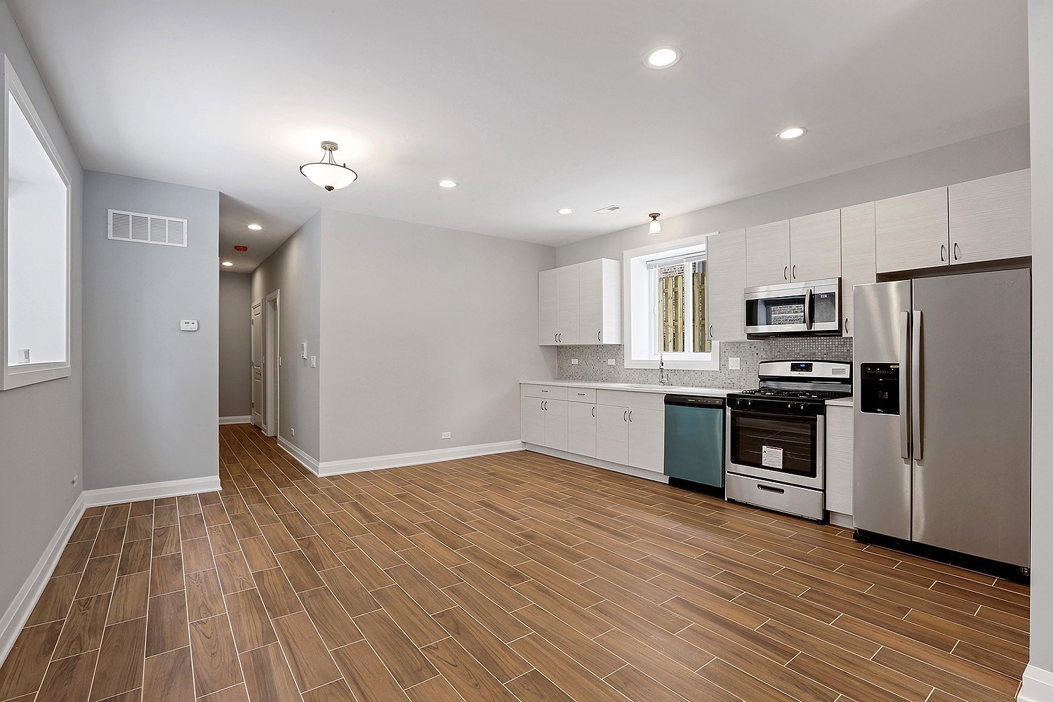 5955 West Superior Street, Unit G Chicago, IL 60644 - Photo 3 of 6 a view of kitchen electric appliances and cabinets