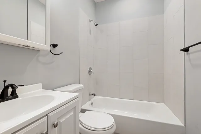 a bathroom with a sink toilet and bathtub