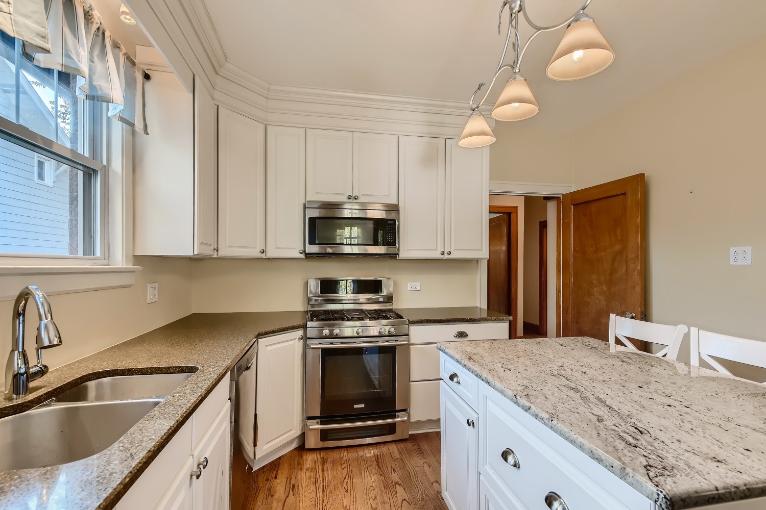 341 Nuttall Road Riverside, IL 60546 - Photo 8 of 28 a kitchen with granite countertop a sink stainless steel appliances and cabinets
