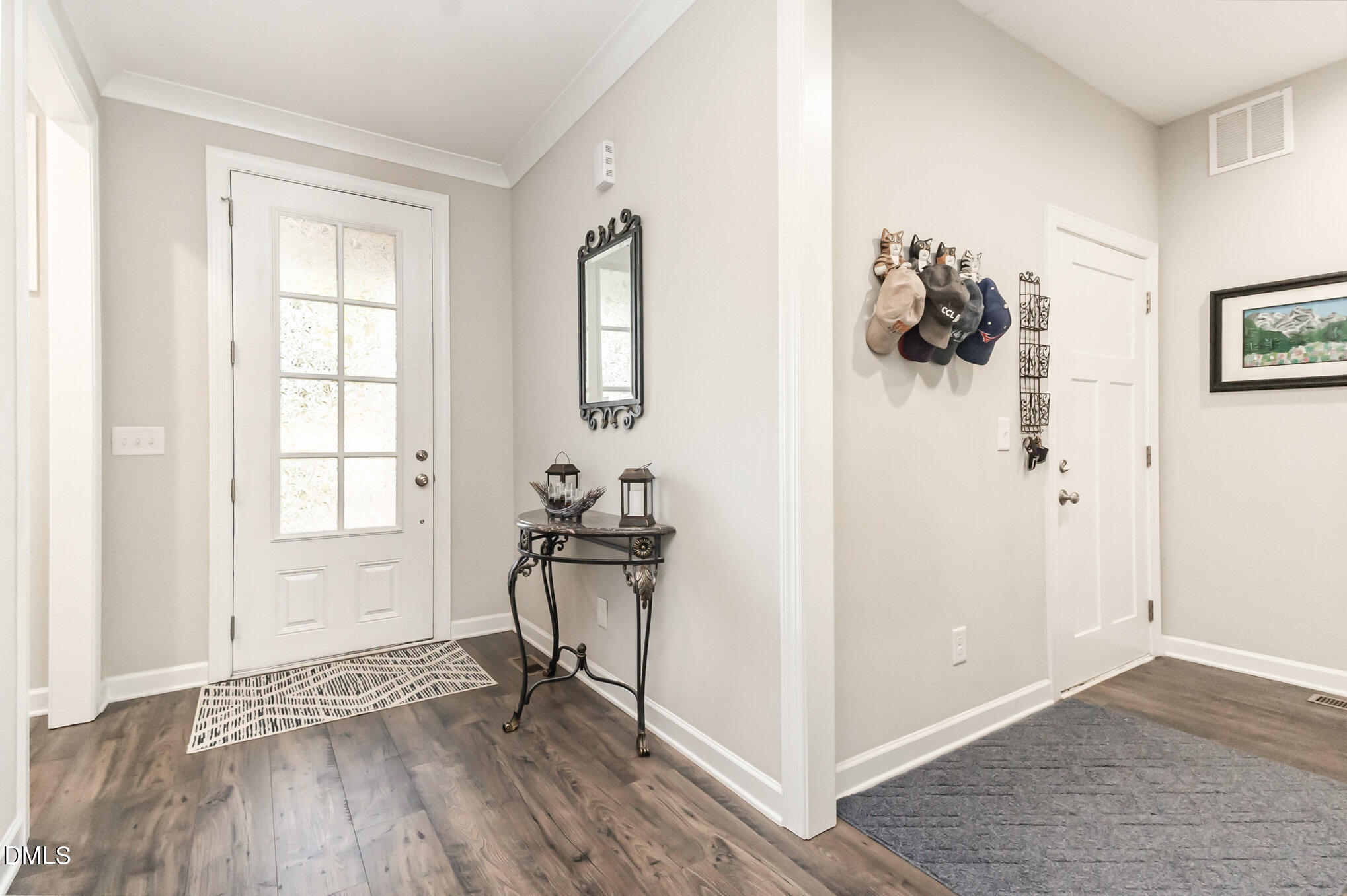 128 Waterleaf Place Clayton, NC 27527 - Photo 12 of 57 a view of a livingroom with wooden floor and a window