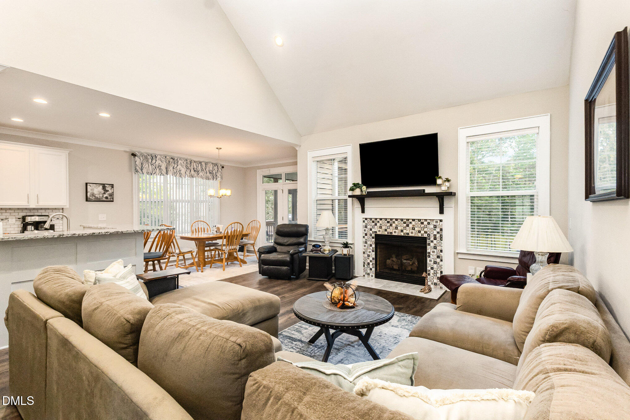 128 Waterleaf Place Clayton, NC 27527 - Photo 18 of 57 a living room with furniture fireplace and flat screen tv