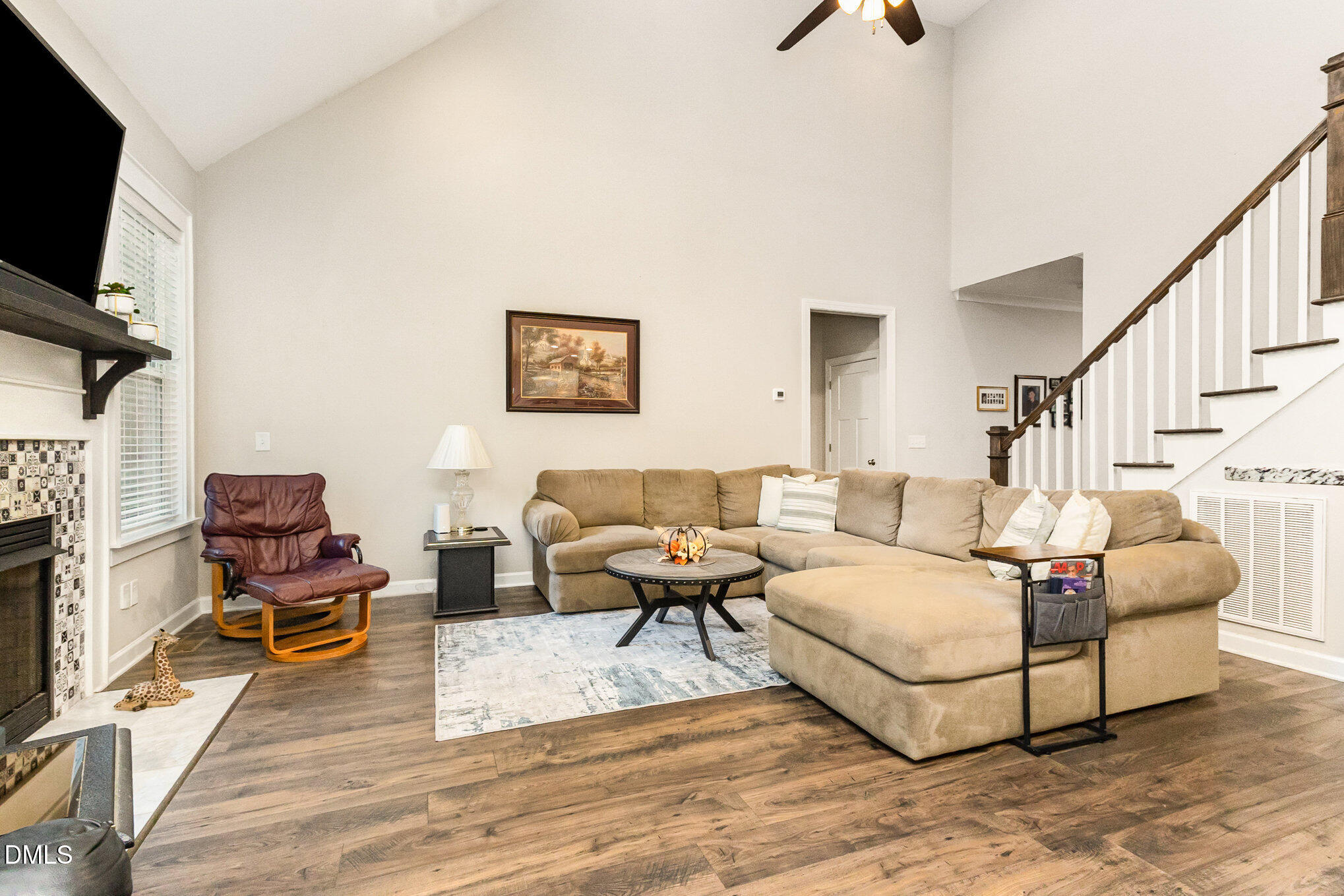 128 Waterleaf Place Clayton, NC 27527 - Photo 20 of 57 a living room with furniture and a flat screen tv