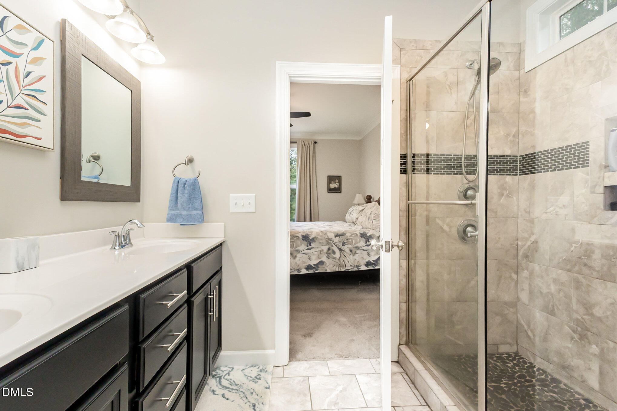 128 Waterleaf Place Clayton, NC 27527 - Photo 23 of 57 a en suite bathroom with a sink double vanity and a shower