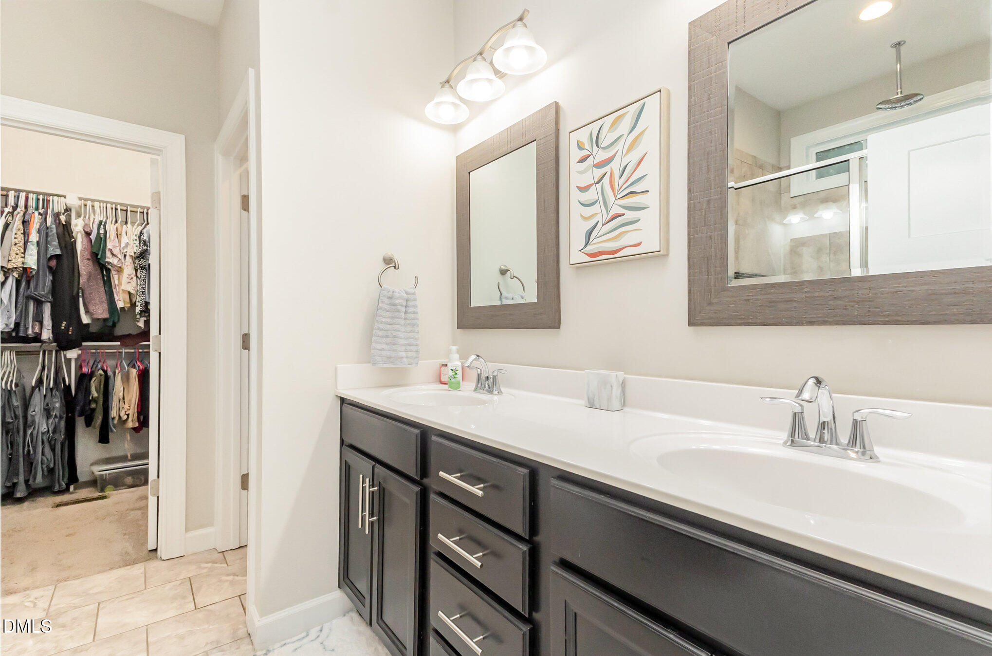 128 Waterleaf Place Clayton, NC 27527 - Photo 24 of 57 a bathroom with a sink and a mirror