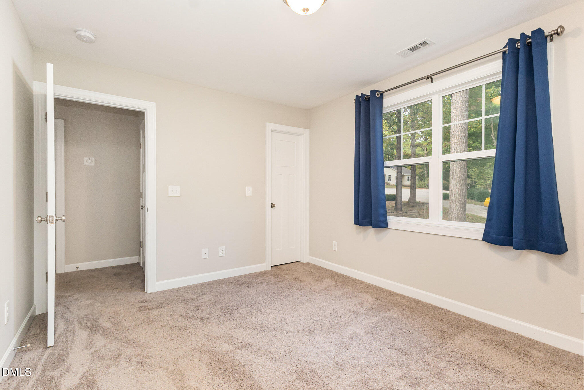 128 Waterleaf Place Clayton, NC 27527 - Photo 28 of 57 a view of an empty room with a window