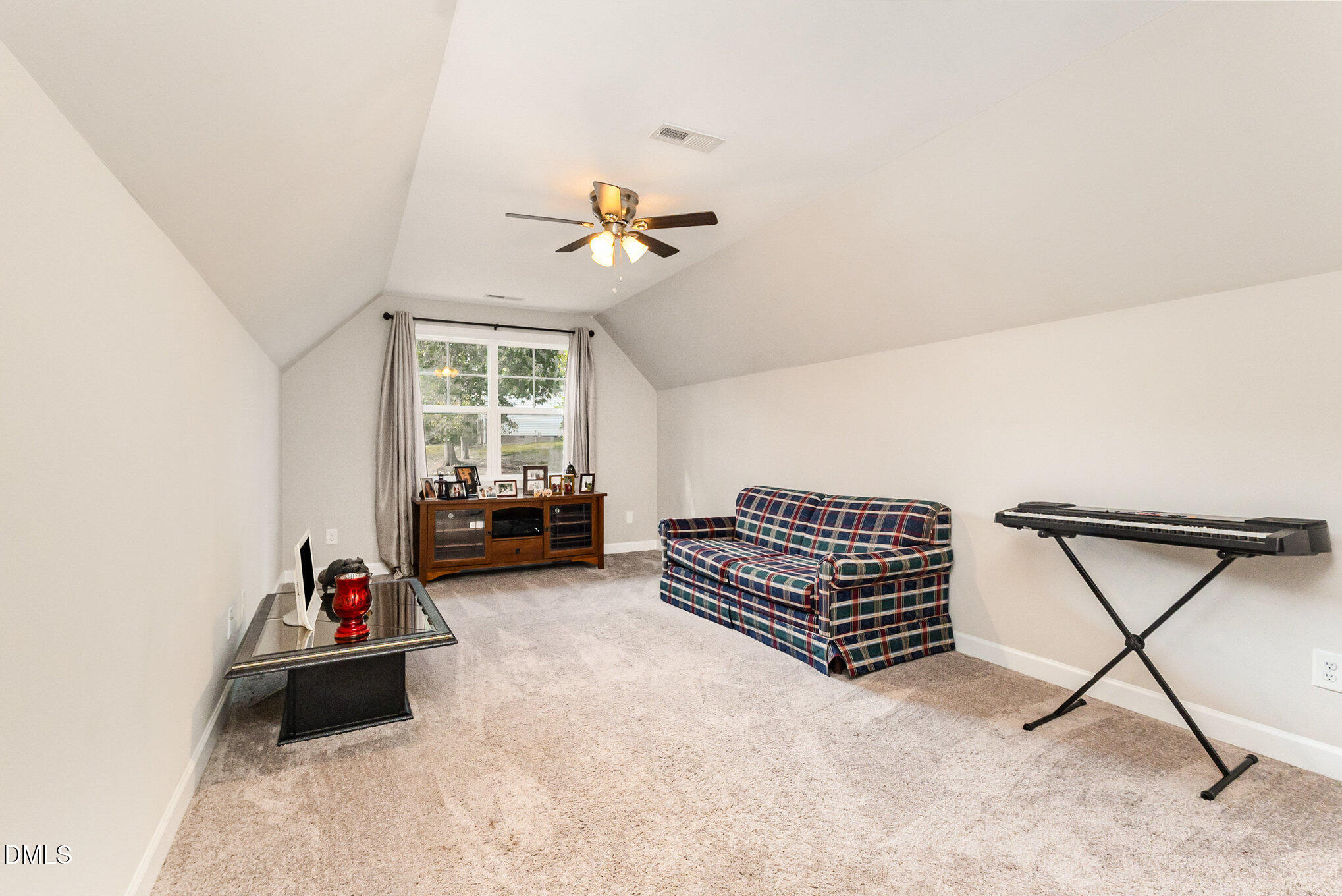 128 Waterleaf Place Clayton, NC 27527 - Photo 31 of 57 a living room with furniture gym equipment and a couch