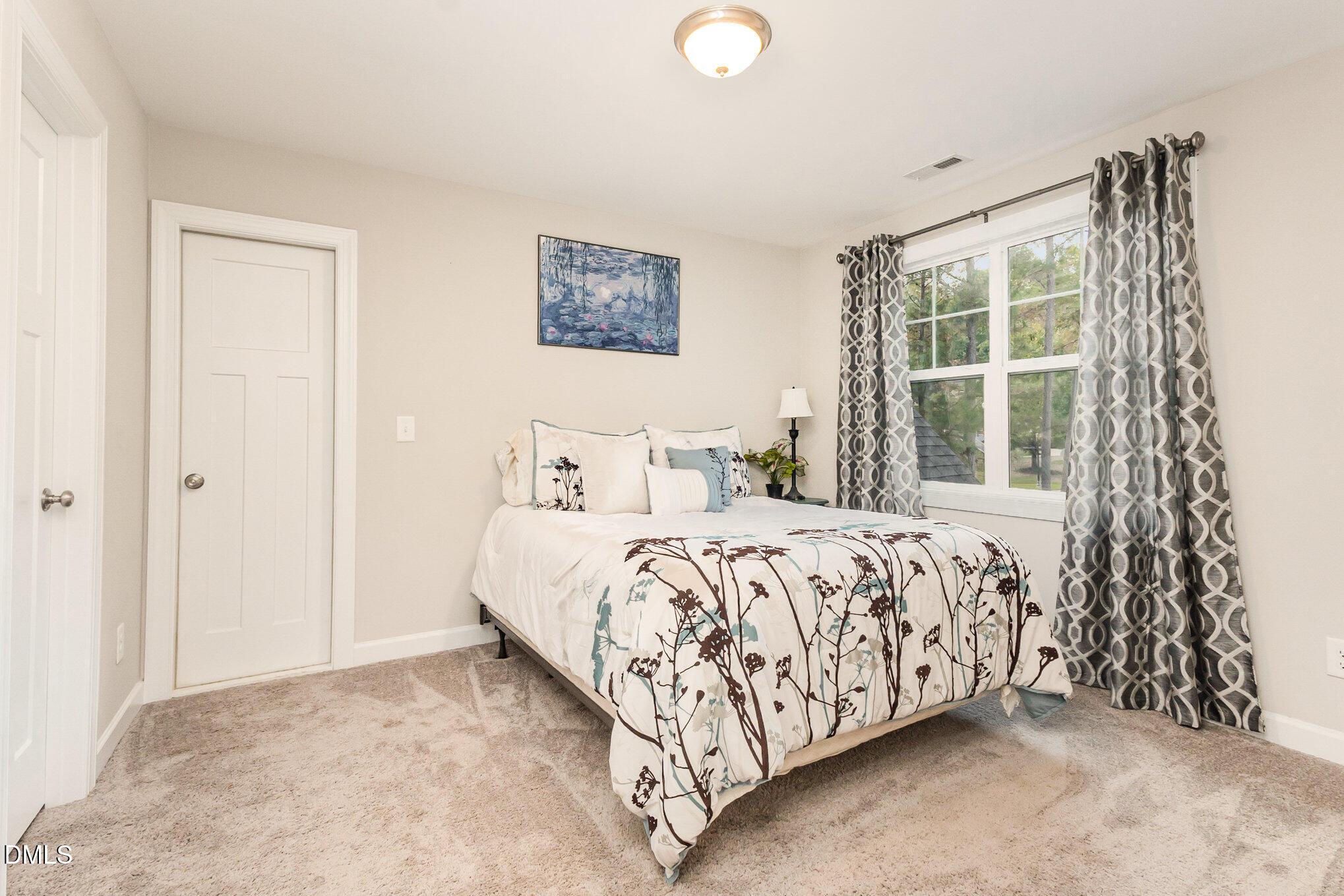 128 Waterleaf Place Clayton, NC 27527 - Photo 33 of 57 a bedroom with a bed and a window