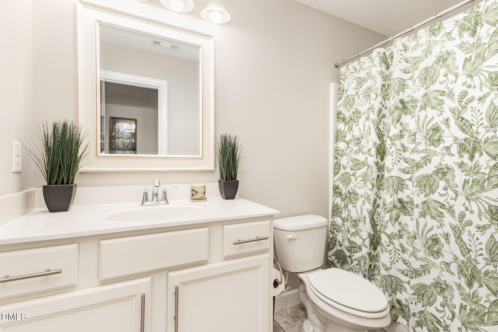 128 Waterleaf Place Clayton, NC 27527 - Photo 34 of 57 a bathroom with a toilet sink and mirror
