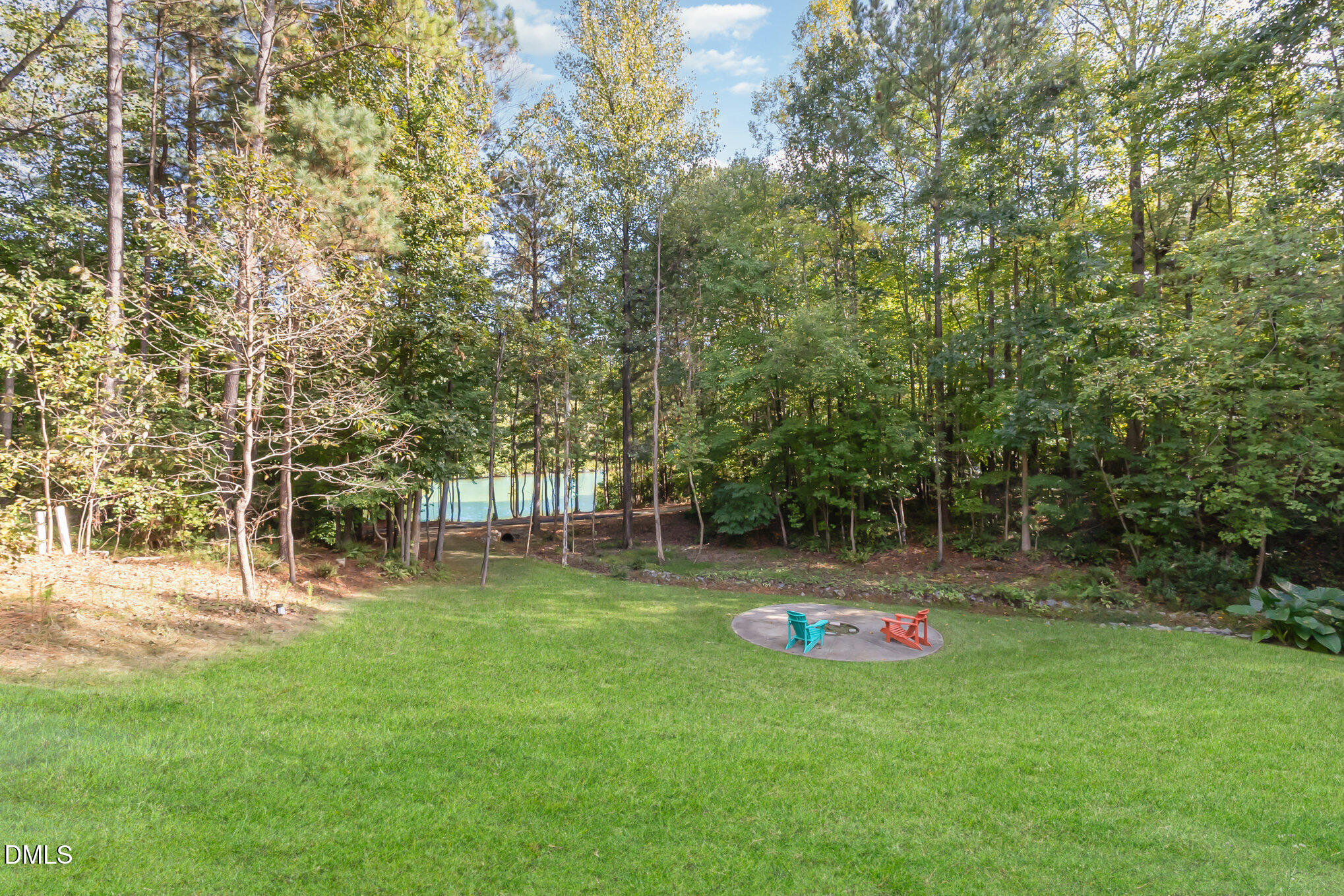 128 Waterleaf Place Clayton, NC 27527 - Photo 44 of 57 a backyard of a house with lots of green space and plants