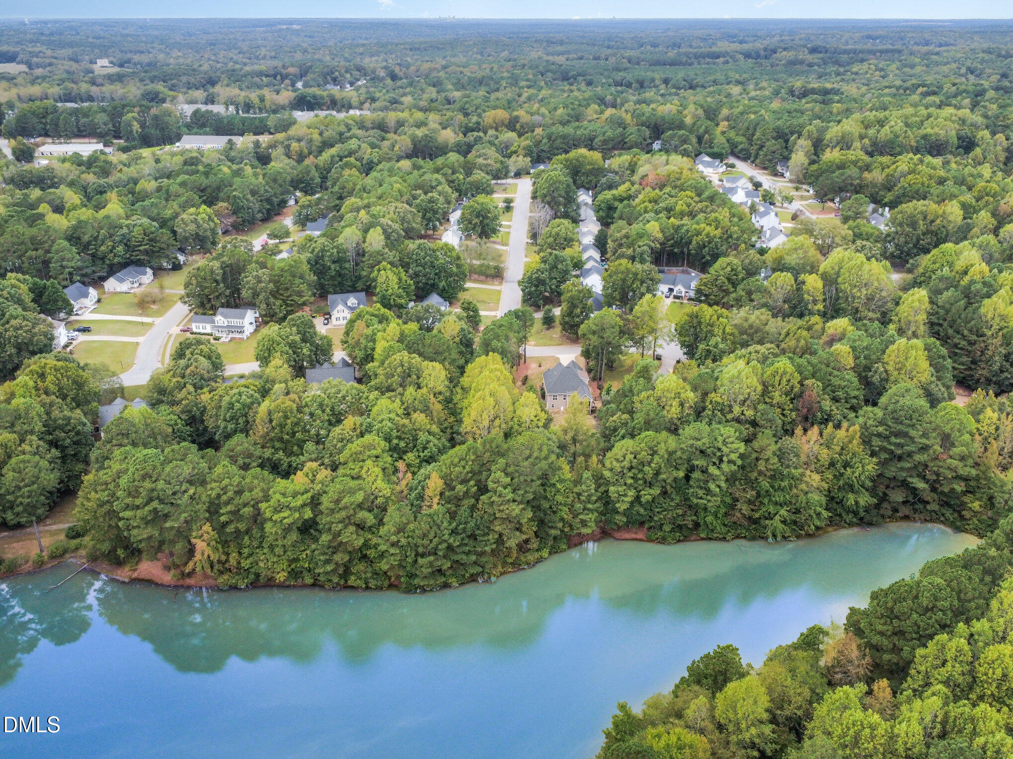 128 Waterleaf Place Clayton, NC 27527 - Photo 47 of 57 an aerial view of residential houses with outdoor space and trees