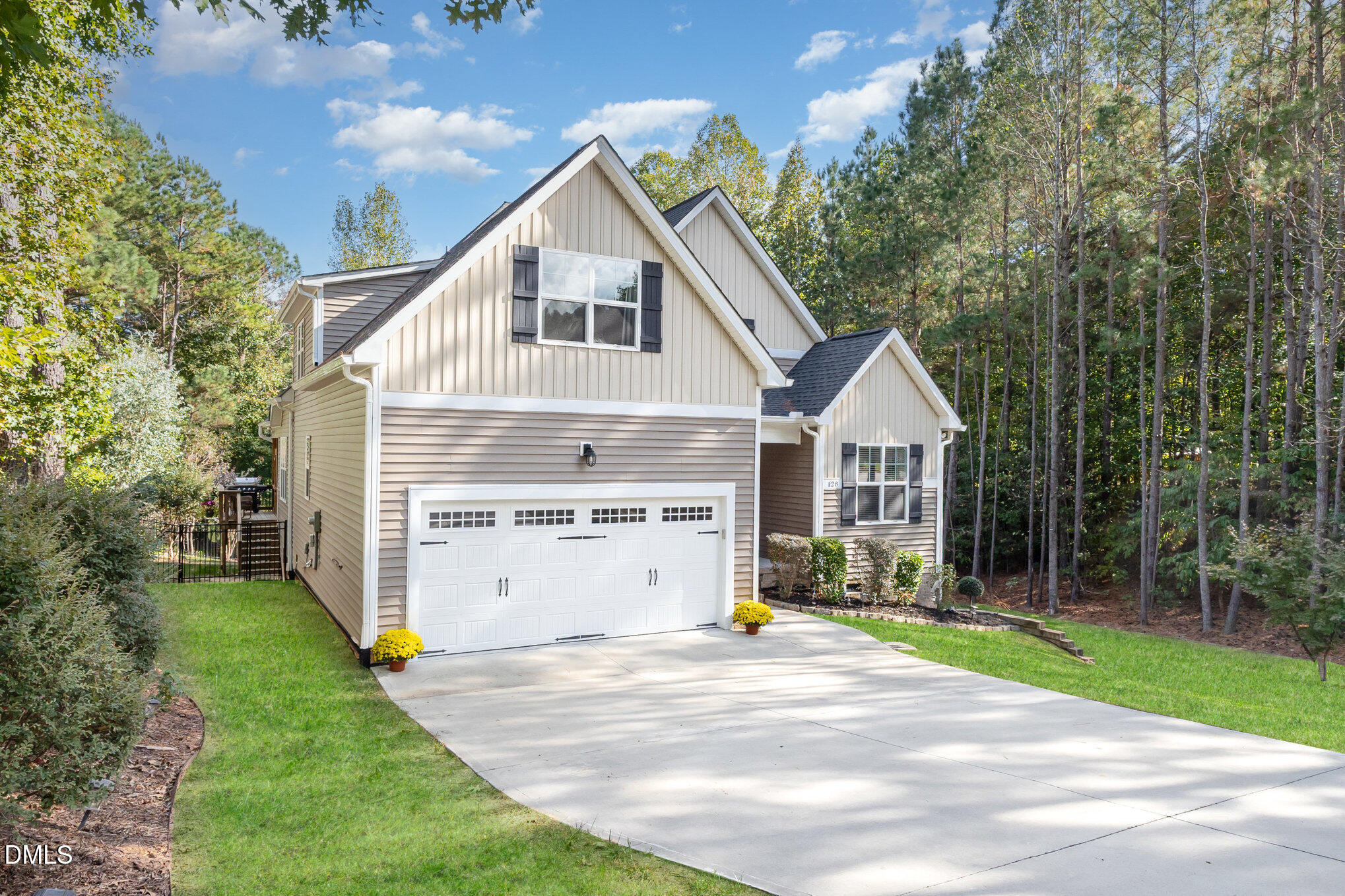 128 Waterleaf Place Clayton, NC 27527 - Photo 3 of 57 a view of a house with backyard and trees