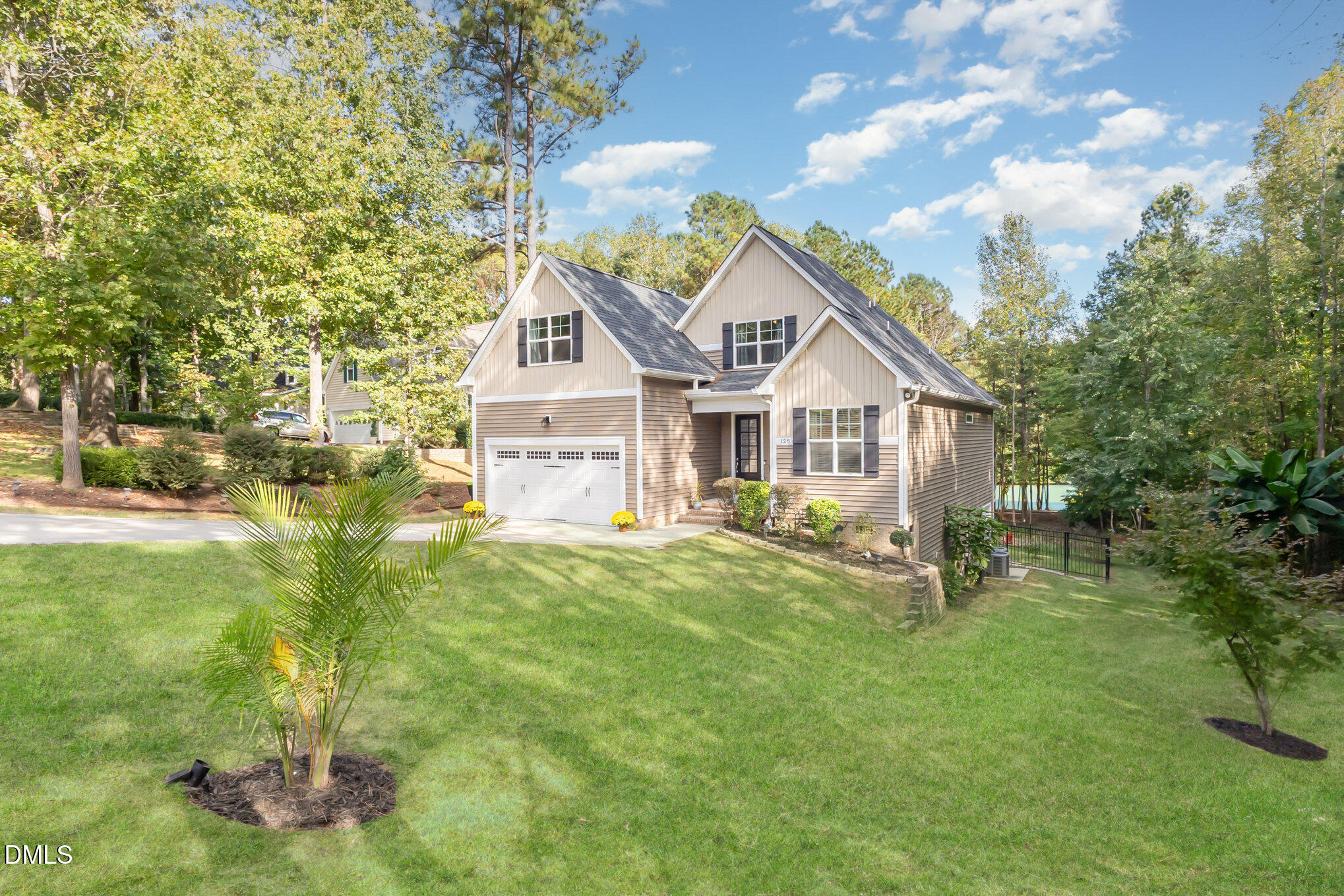 128 Waterleaf Place Clayton, NC 27527 - Photo 4 of 57 a view of a house with a yard and sitting area