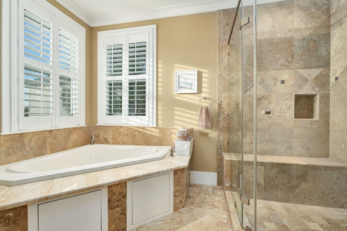 20 Sawgrass Lane Santa Rosa Beach, FL 32459 - Photo 13 of 25 a bathroom with a tub and a shower