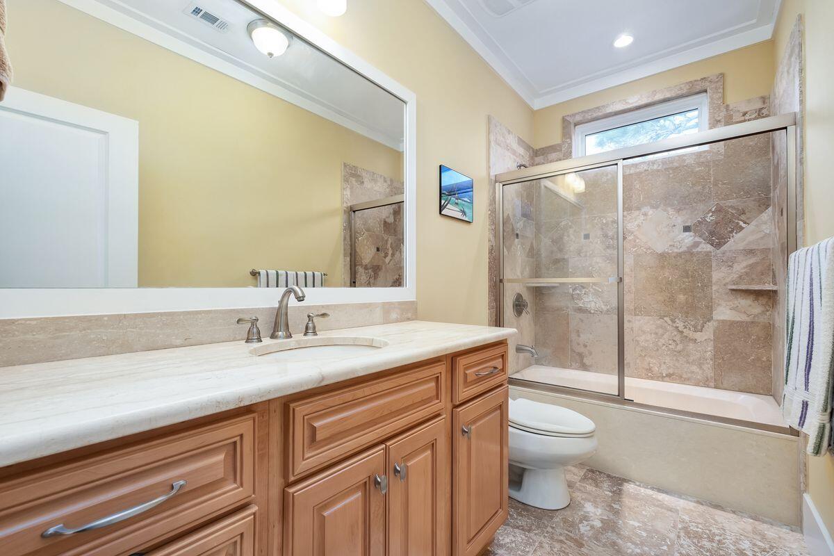 20 Sawgrass Lane Santa Rosa Beach, FL 32459 - Photo 19 of 25 a bathroom with a granite countertop sink toilet mirror and shower