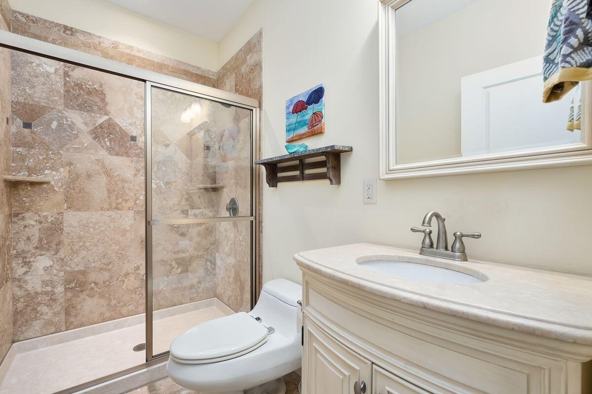 20 Sawgrass Lane Santa Rosa Beach, FL 32459 - Photo 20 of 25 a bathroom with a sink a toilet and shower